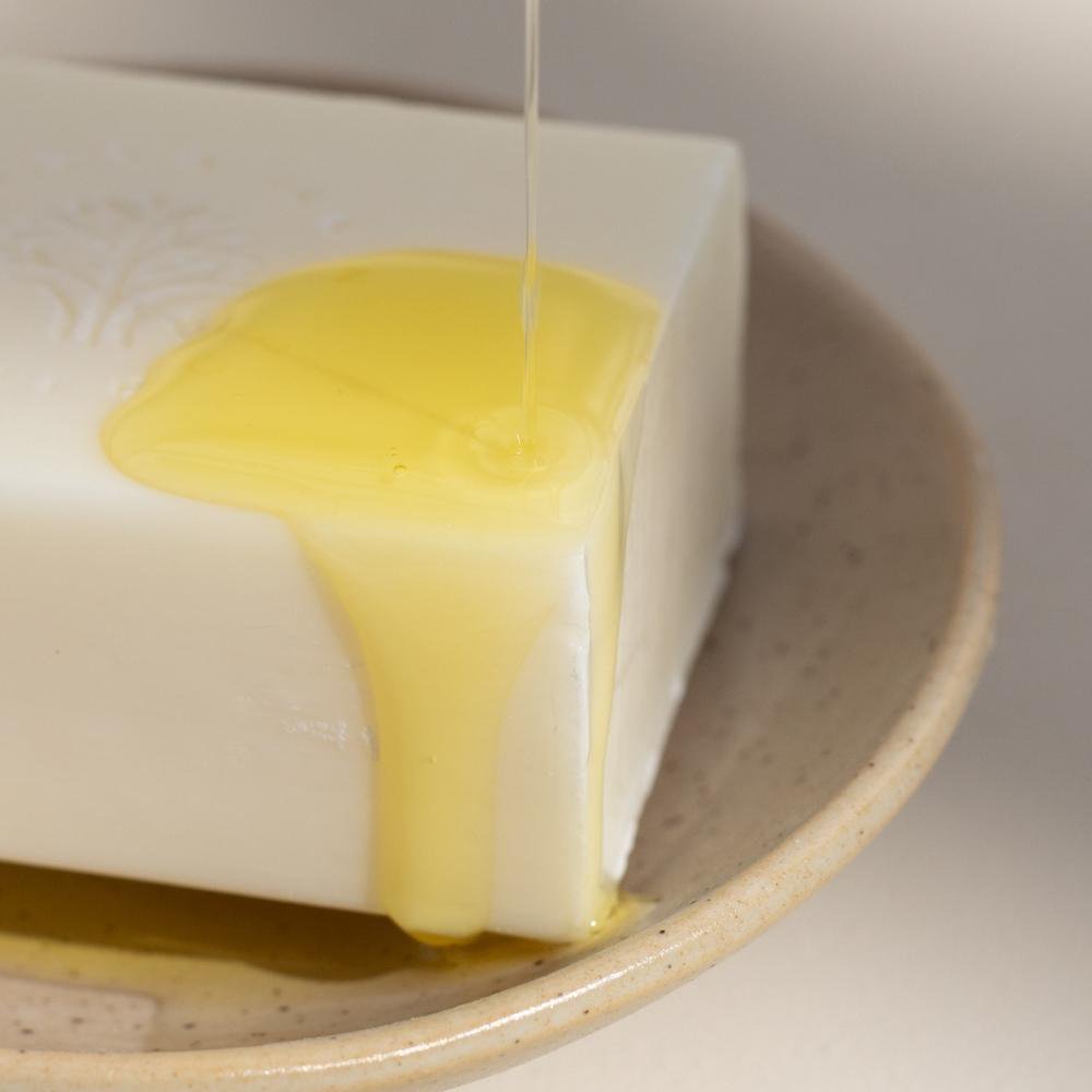 Mānuka oil dripped on top of ManukaRx Extra Gentle Cleansing Soap bar
