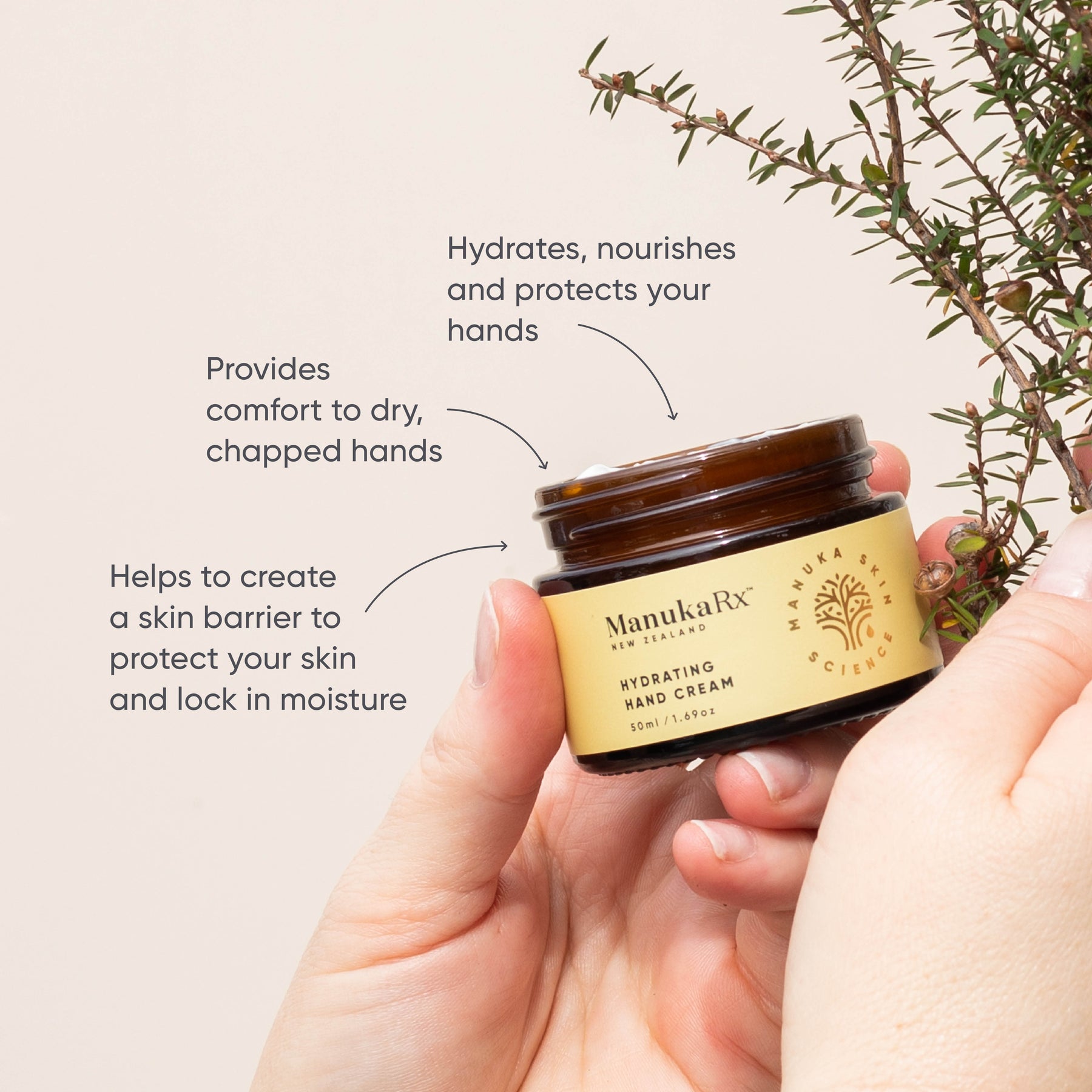 Hand holding jar of ManukaRx Hydrating Hand Cream with product benefits listed around the jar