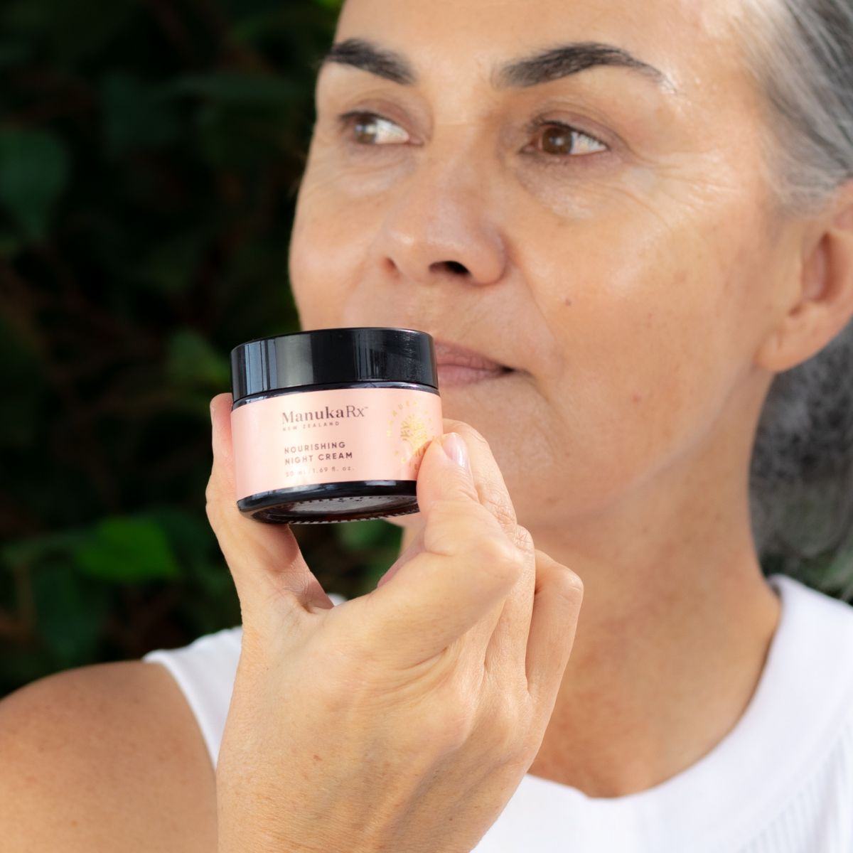 Women holding a jar of the Nourishing Night Cream